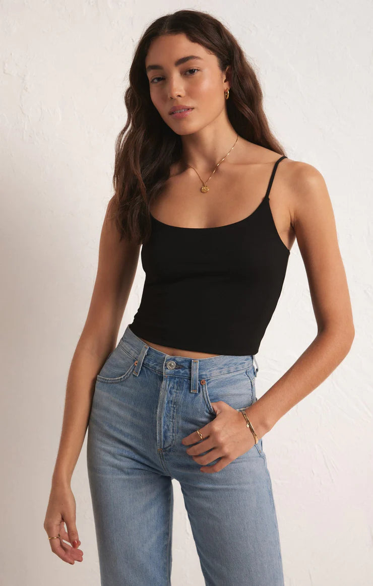 Featuring a fitted cropped cami in the color black