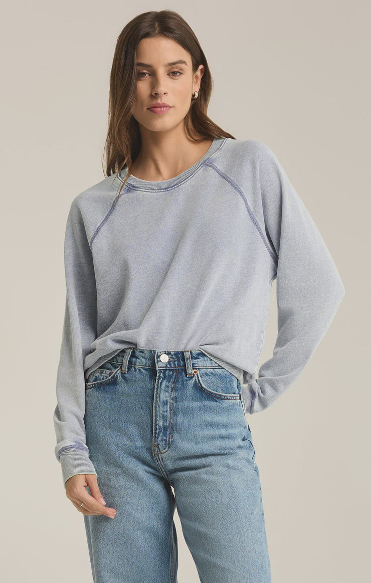 Featuring a mineral wash long sleeve crew neck in the shade washed indigo 