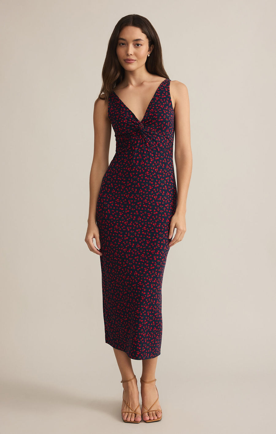 Featuring a twist front V neck midi dress with floral print in the colors black and red 