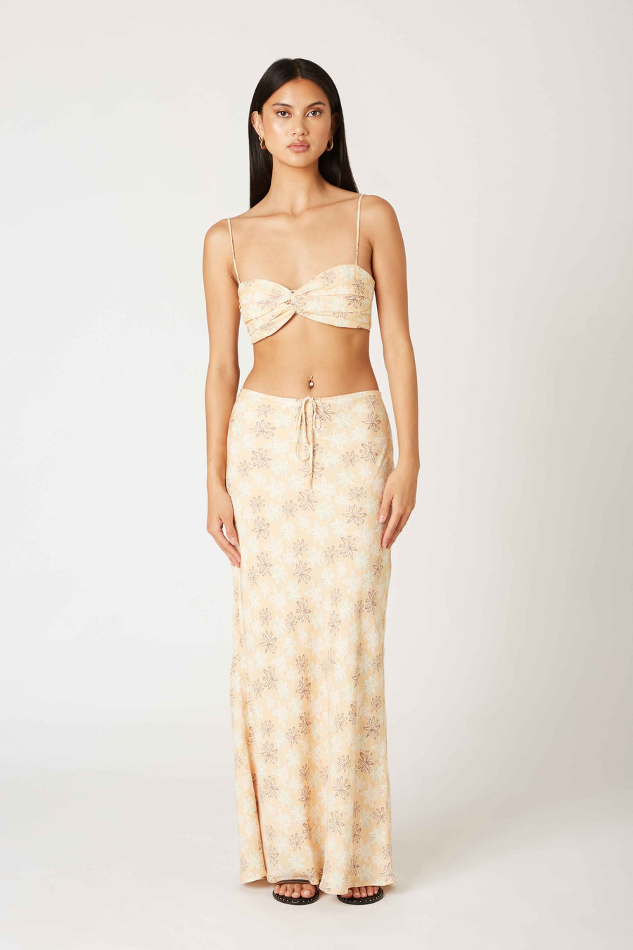 Pairs with the matching Finnley Floral Maxi Skirt

Featuring a floral twist front cropped tank
In the color yellow 