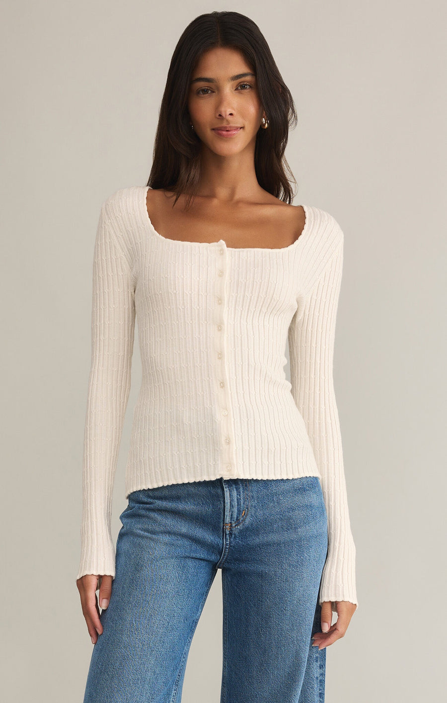 Featuring a ribbed square neck button up sweater top with ribbing throughout in the color sea salt