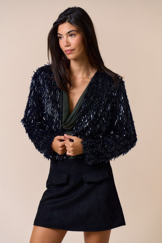 Featuring a light flutter jacket with a soft drape