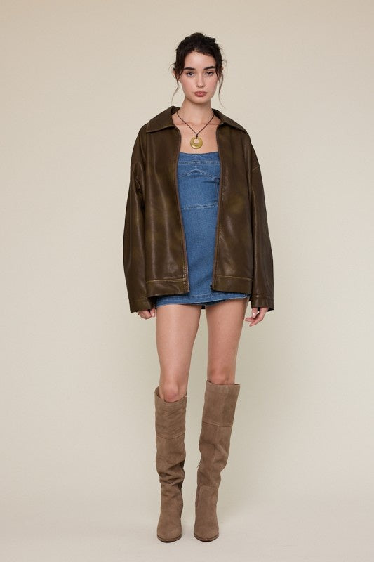 Featuring a faux leather collared oversized jacket
