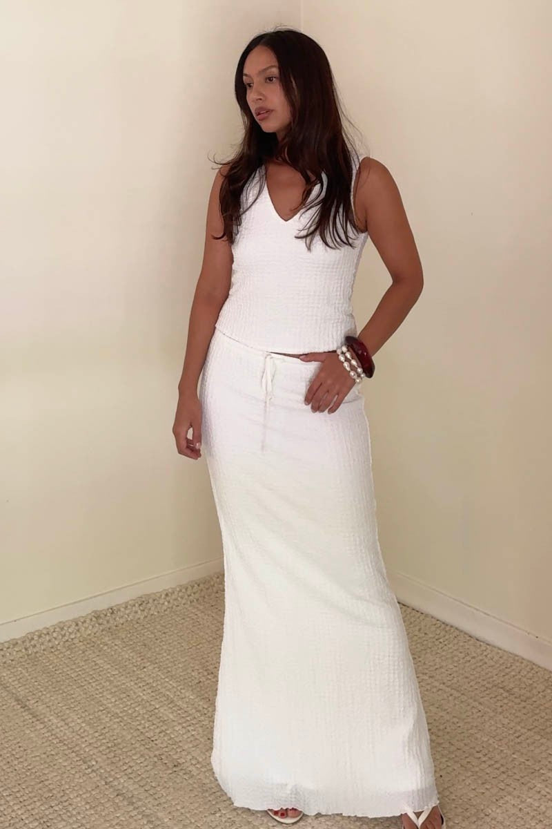 Pairs with the matching 'Ivey Skirt'

Featuring a V neck crop top with bubble textured fabric