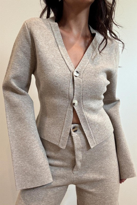 Featuring a V neck cardigan with two button down closures