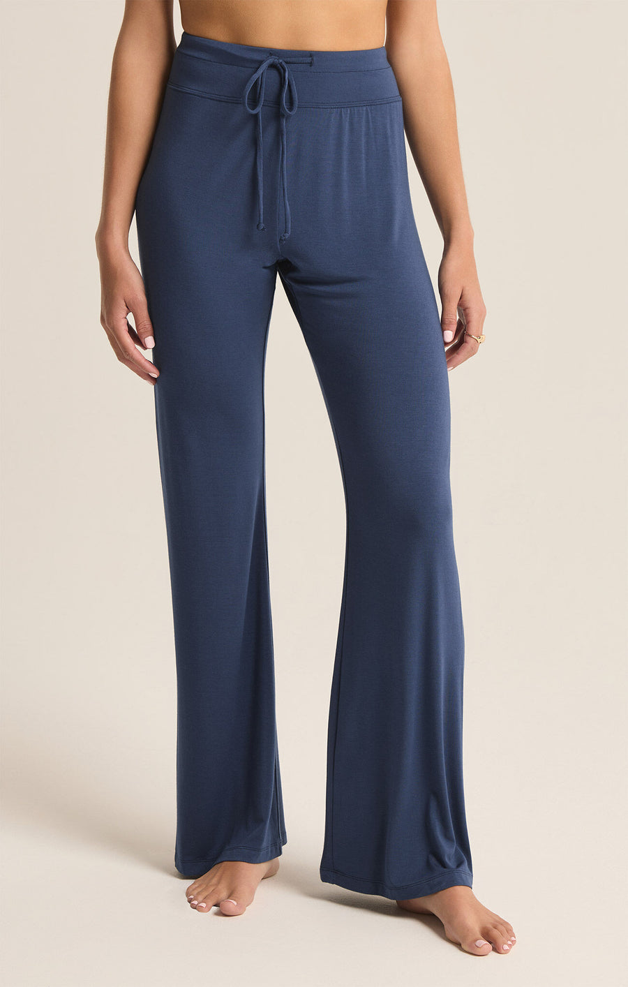 Featuring a flare drawstring pant in the color midnight 