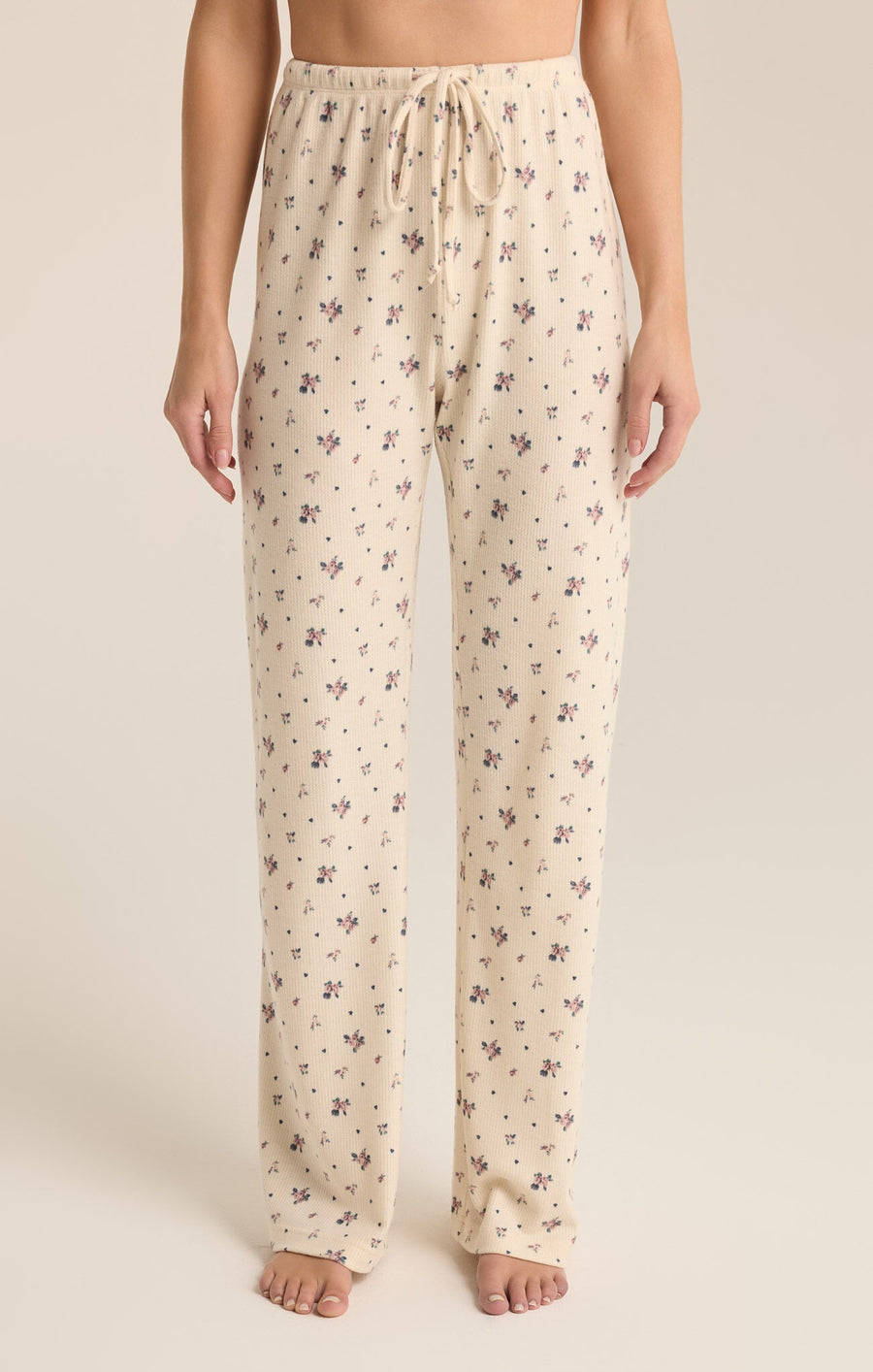 Featuring a floral draw string lounge pant in the color sea salt 