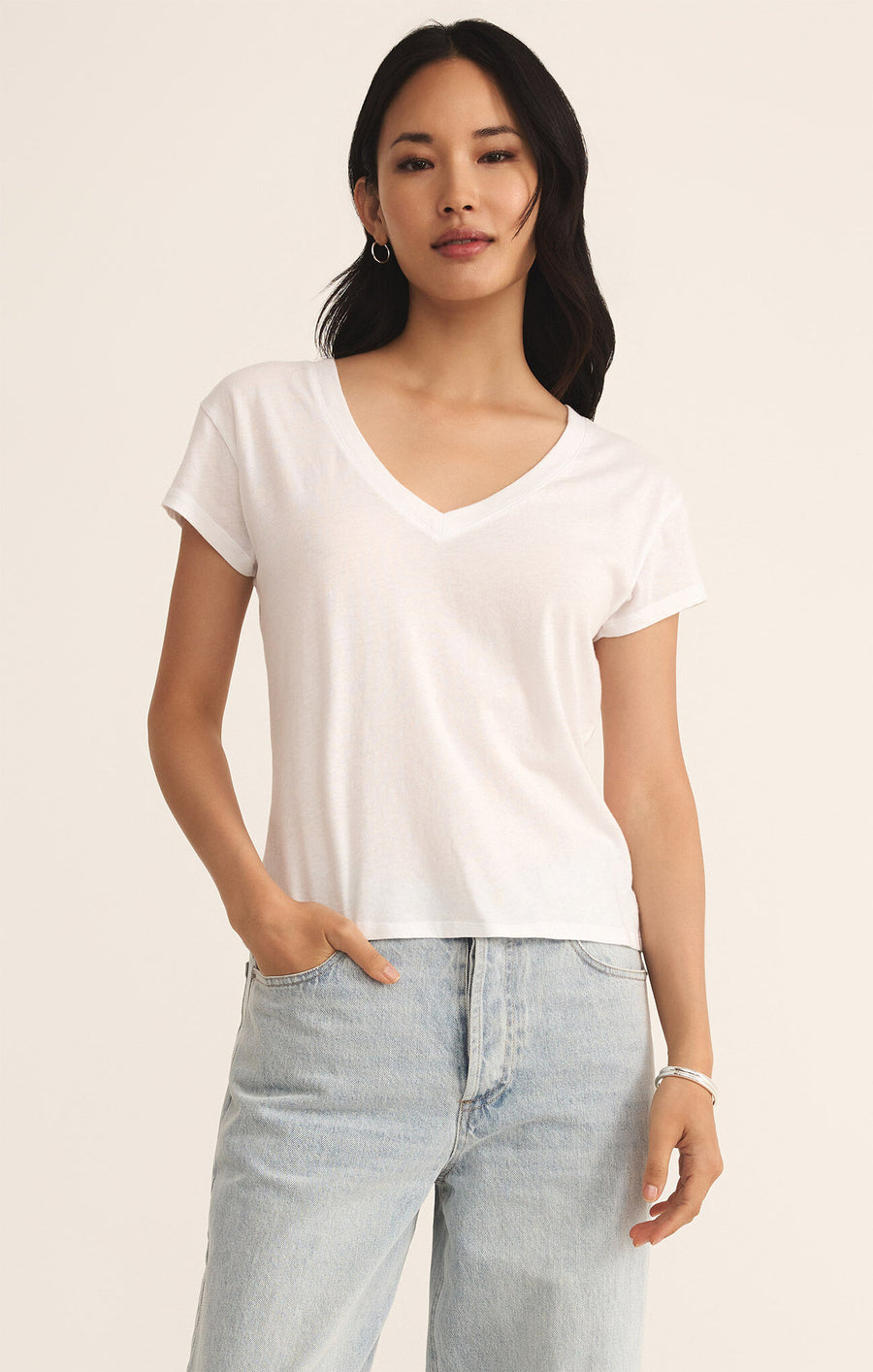 Featuring a regular fit short sleeve V-neck top in the color white 