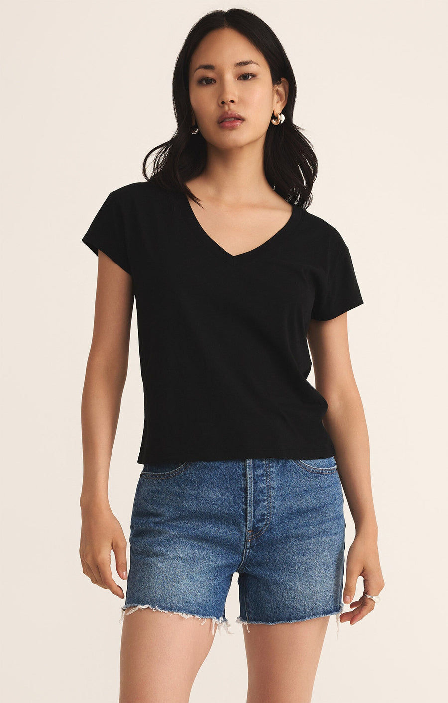 Featuring a regular fit short sleeve V-neck top in the color black 