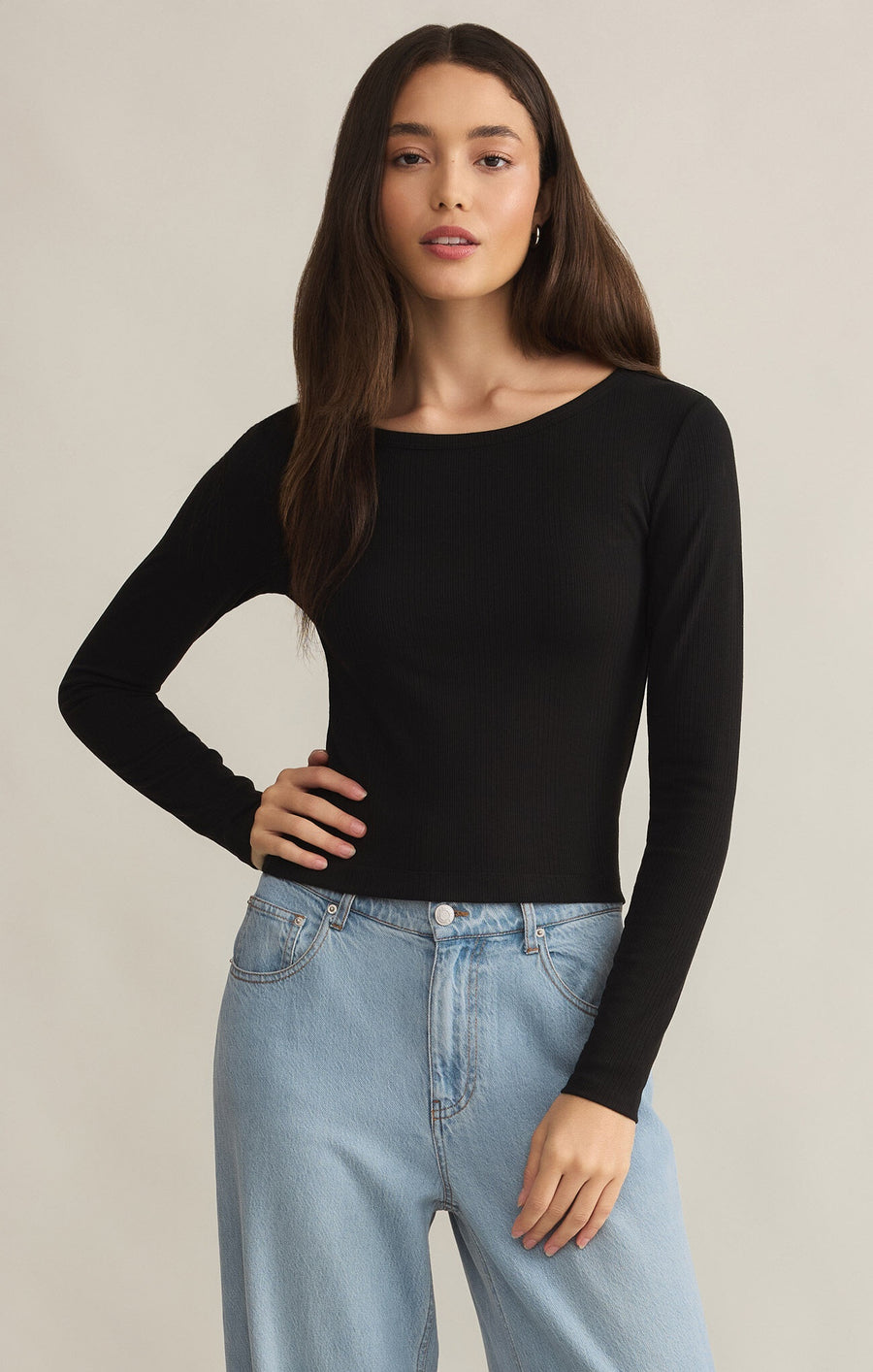 Featuring a fitted crew neck long sleeve top in the color black