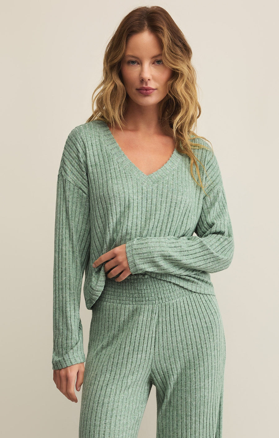 Featuring a V-neck ribbed soft material top in the color light green 