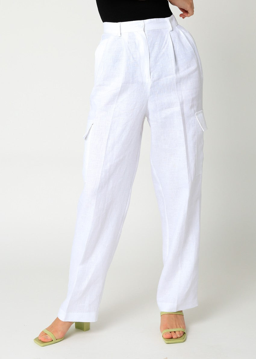 High waisted linen pants with front pleats in the color White.