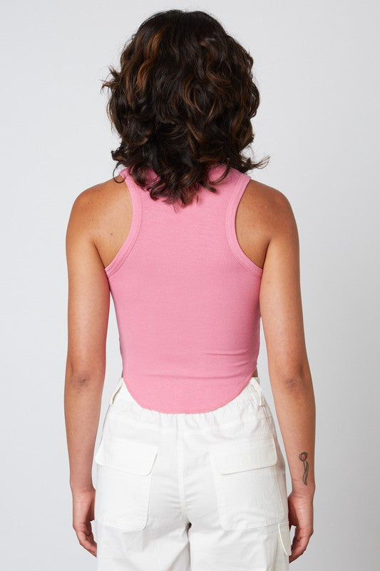 model is wearing a tank top in the color dusty pink.