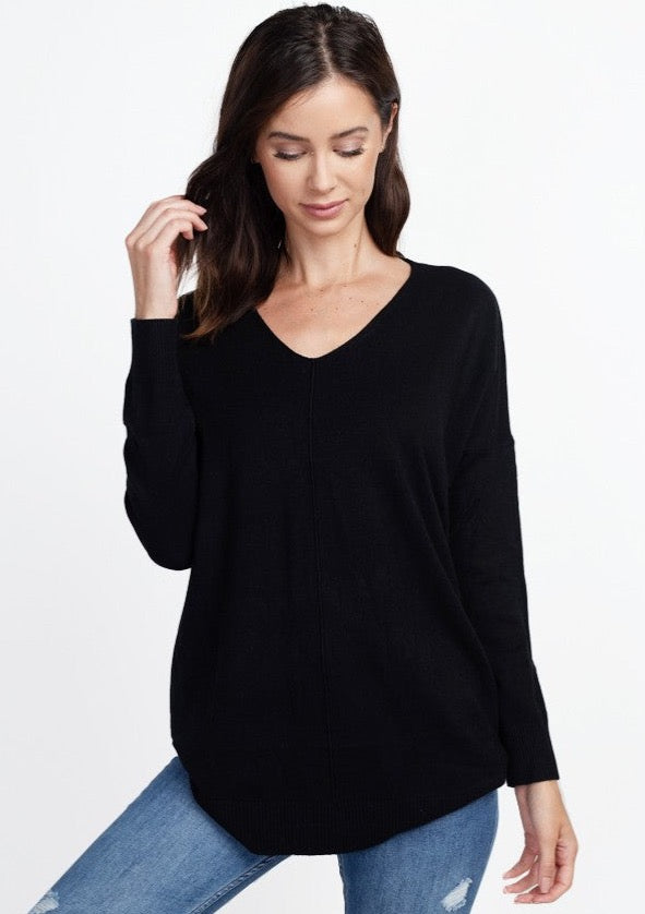 Long sleeve thin sweater with a middle seam in the color black.