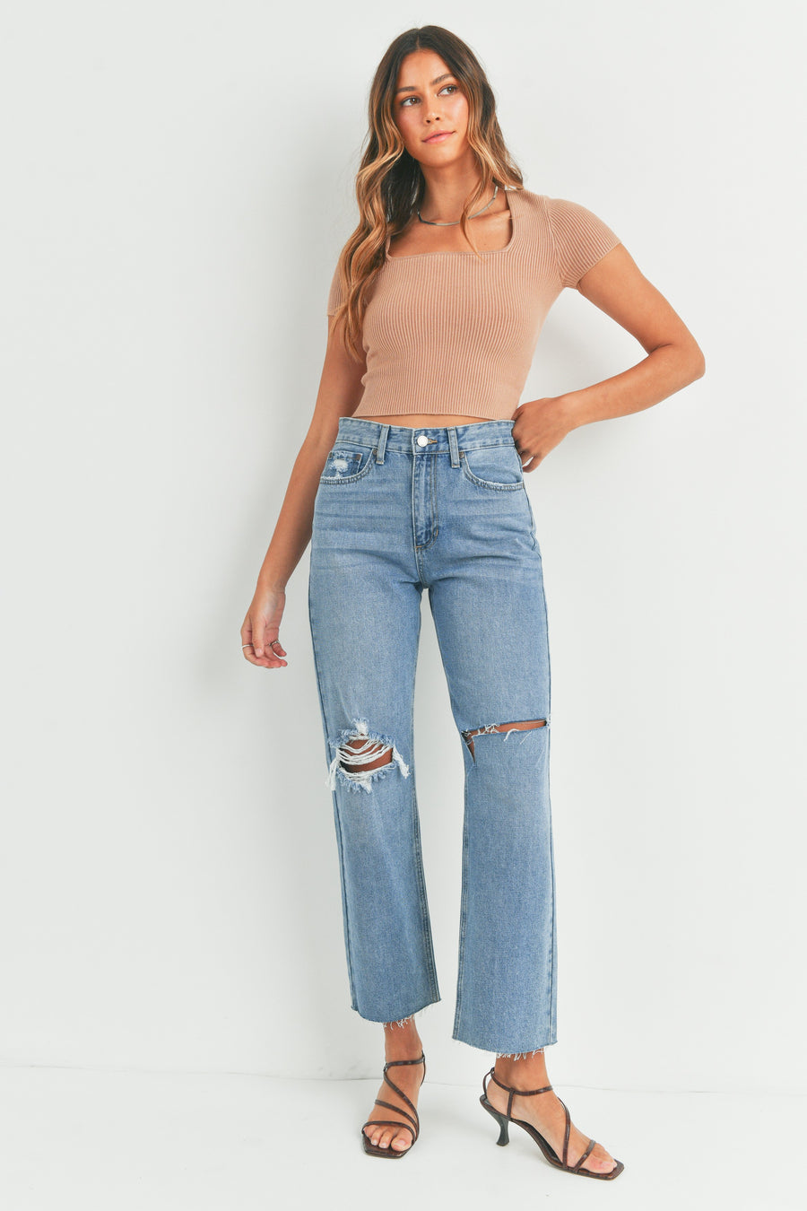 Ultra high-rise destroyed knee straight leg  jeans.