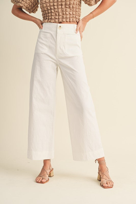  Featruing straight wide leg pant with front pockets in the color white 