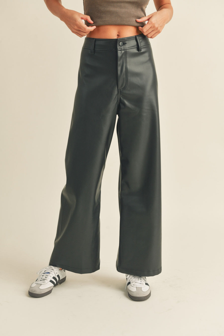 Black PU leather pants with cropped edges. 
