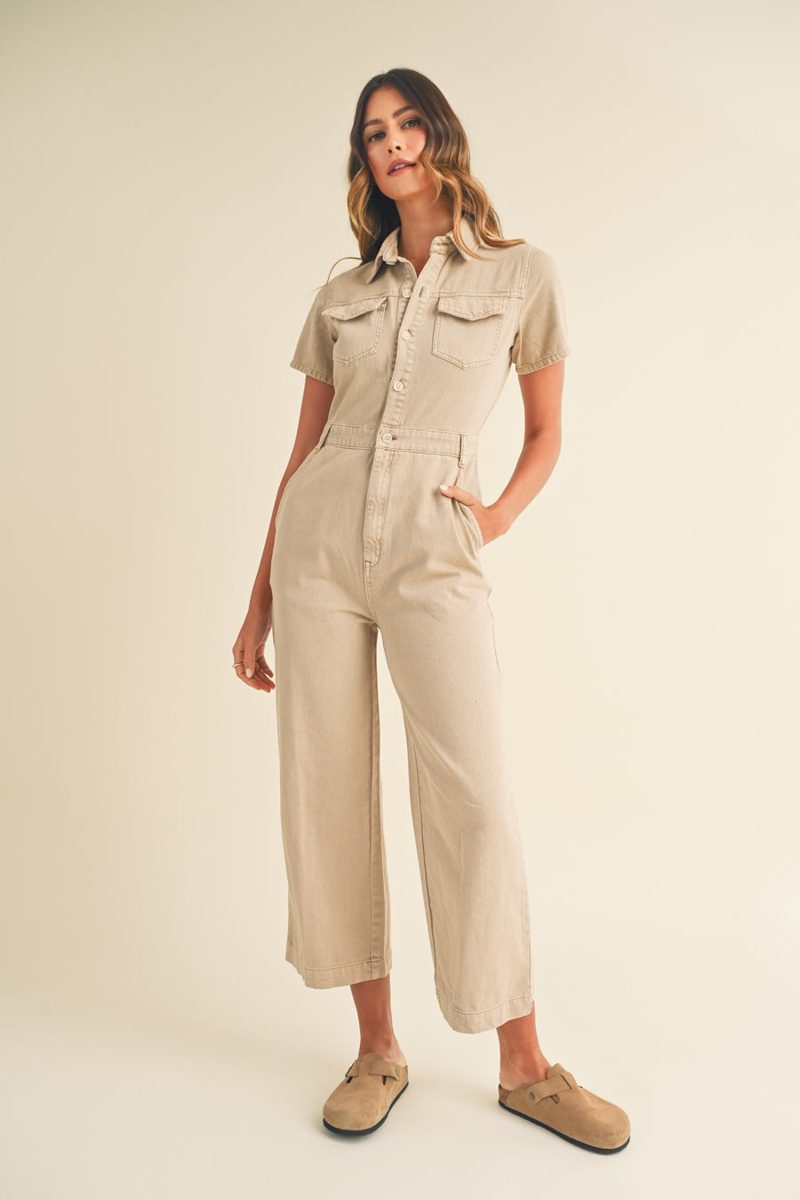 Light Taupe jumpsuit with short sleeves and front pockets. 