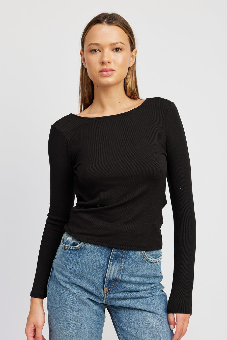 Featuring a black long sleeve with open twisted back