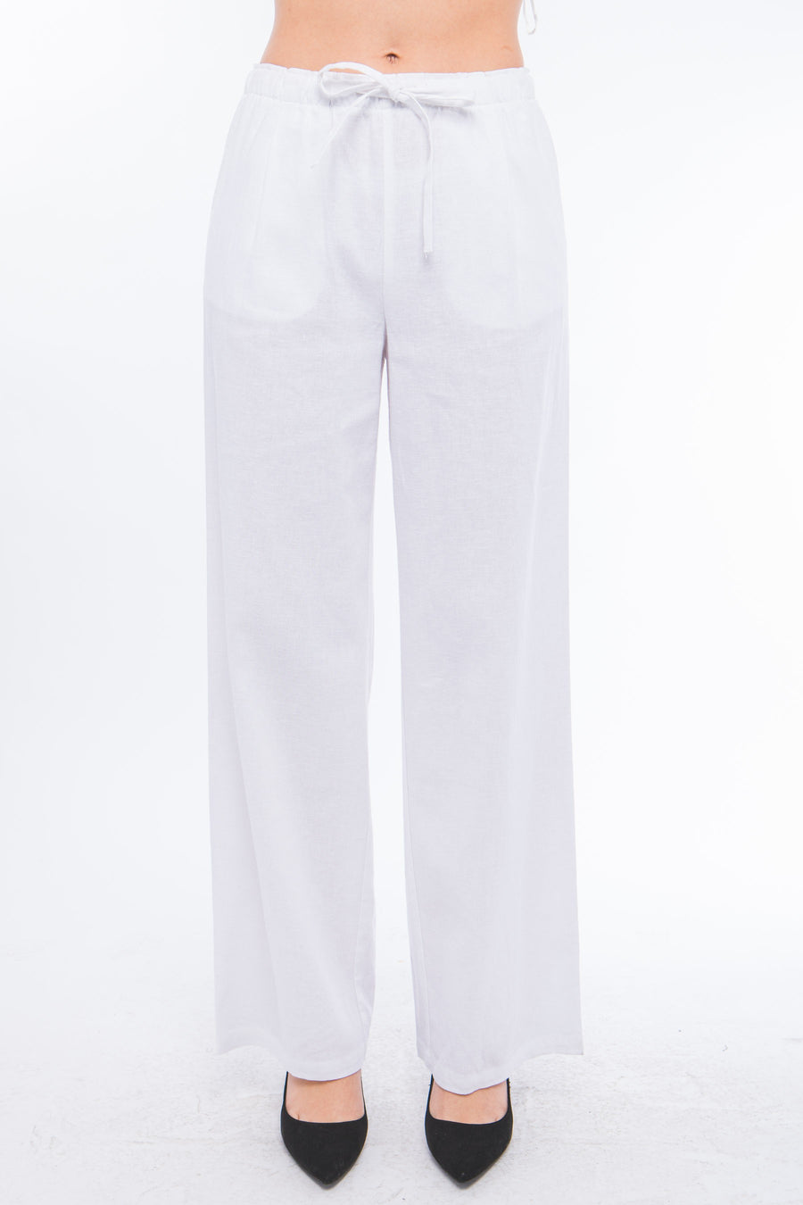 Featuring a wide leg draw string pant with pockets in the color white 