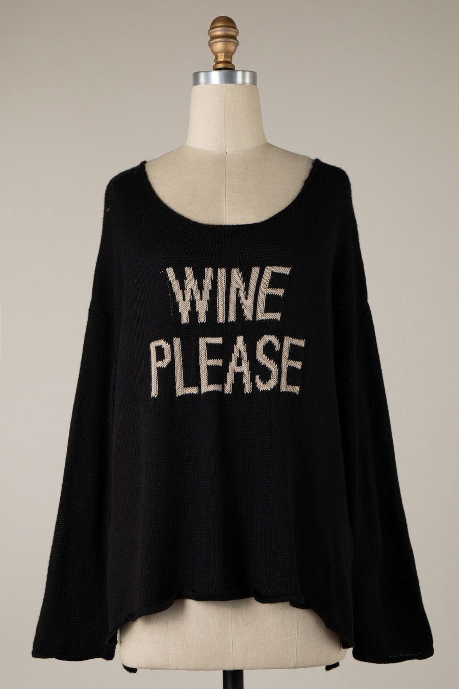 Featuring a ligh weight sweater with the saying "Wine Please" in the front and a wide neckline.