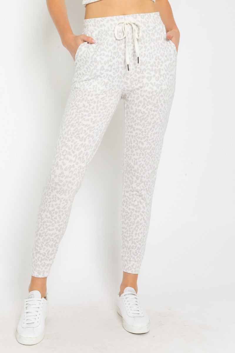 model is wearing white leopard print joggers