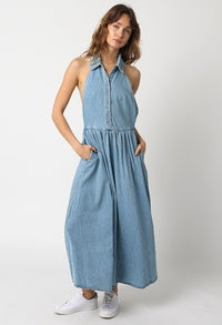 Featuring a denim dress with a collar neck, flared leg and pockets.