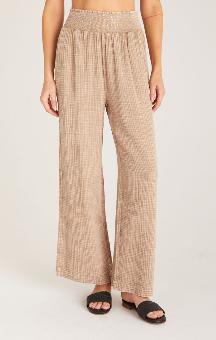 light brown, gauze-like material pants with stretchy elastic waist band to fit. 