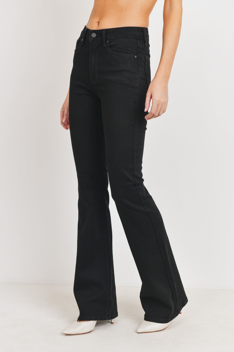 Long denim black jeans with a button and zipper in the front for closure.