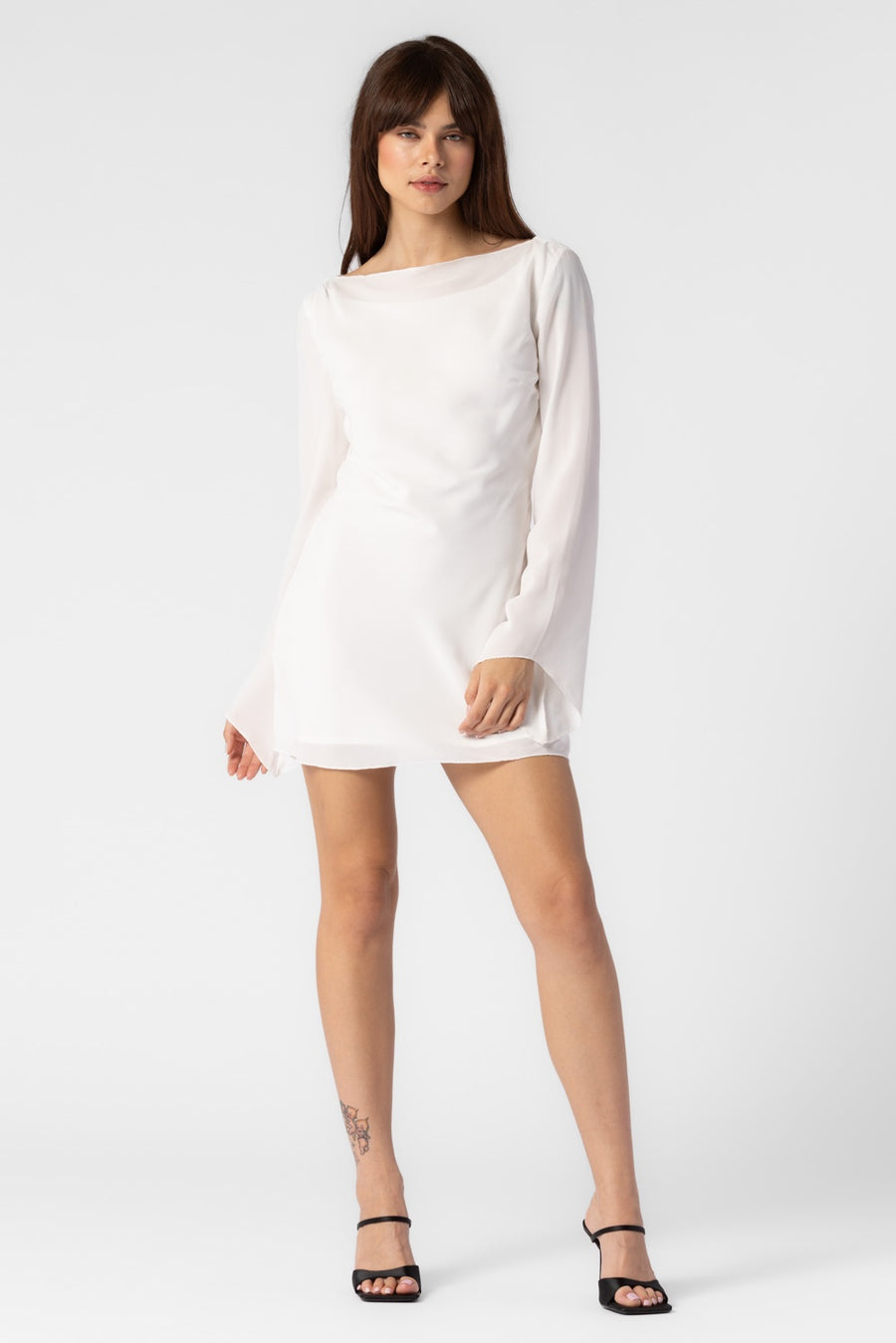 Long sleeve mini dress in the color off white. 