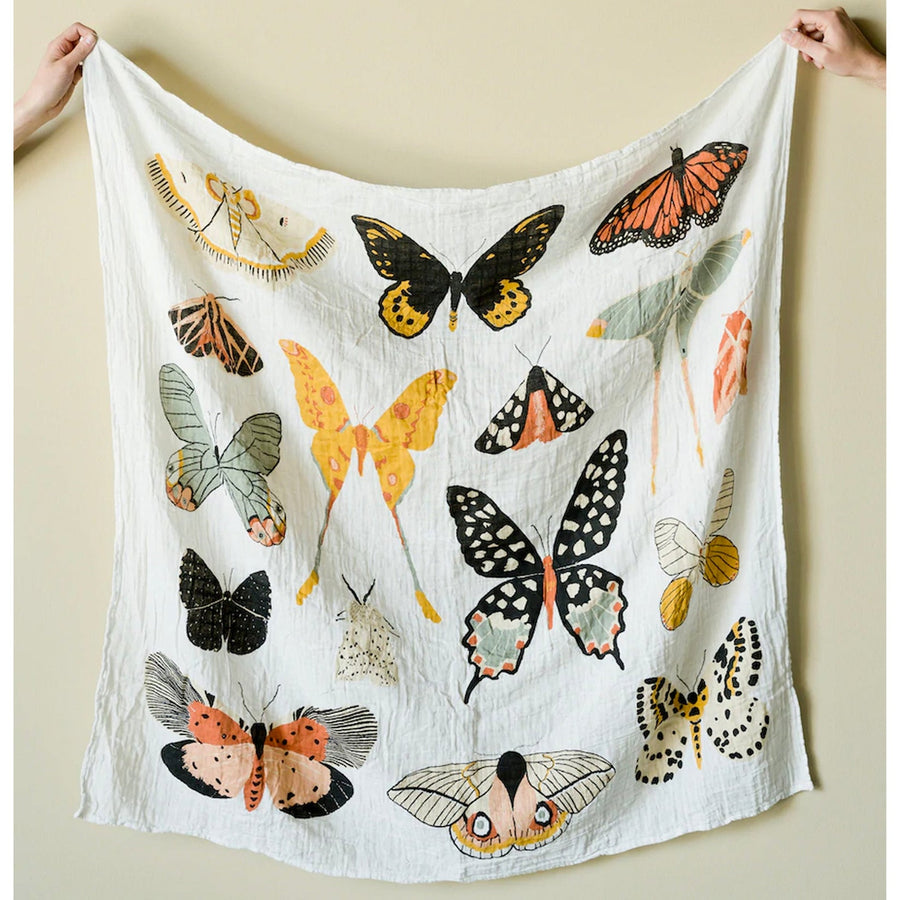 Lightweight and breathable baby blanket with butterfly designs for swaddling. 