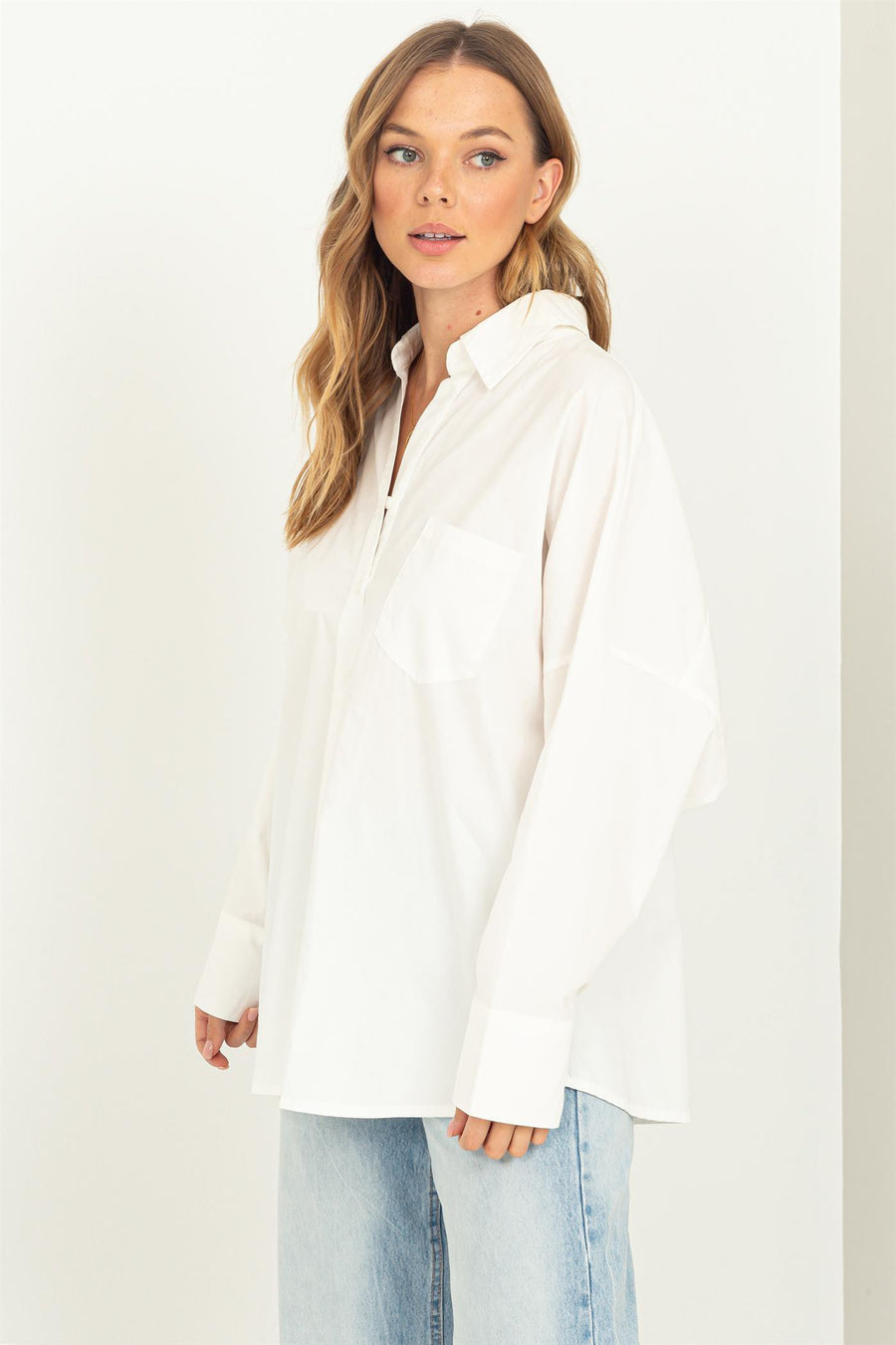 White oversized button up shirt.