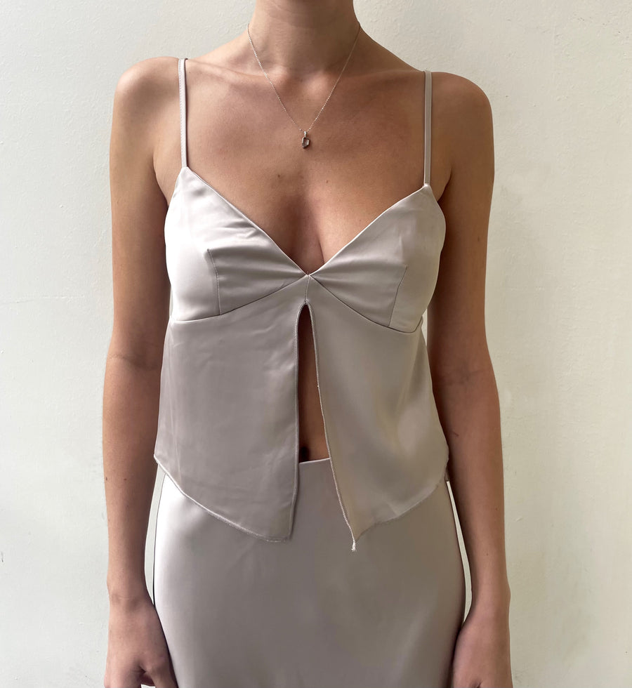 Featuring a V-neck tank with a slit up the front in the color taupe 