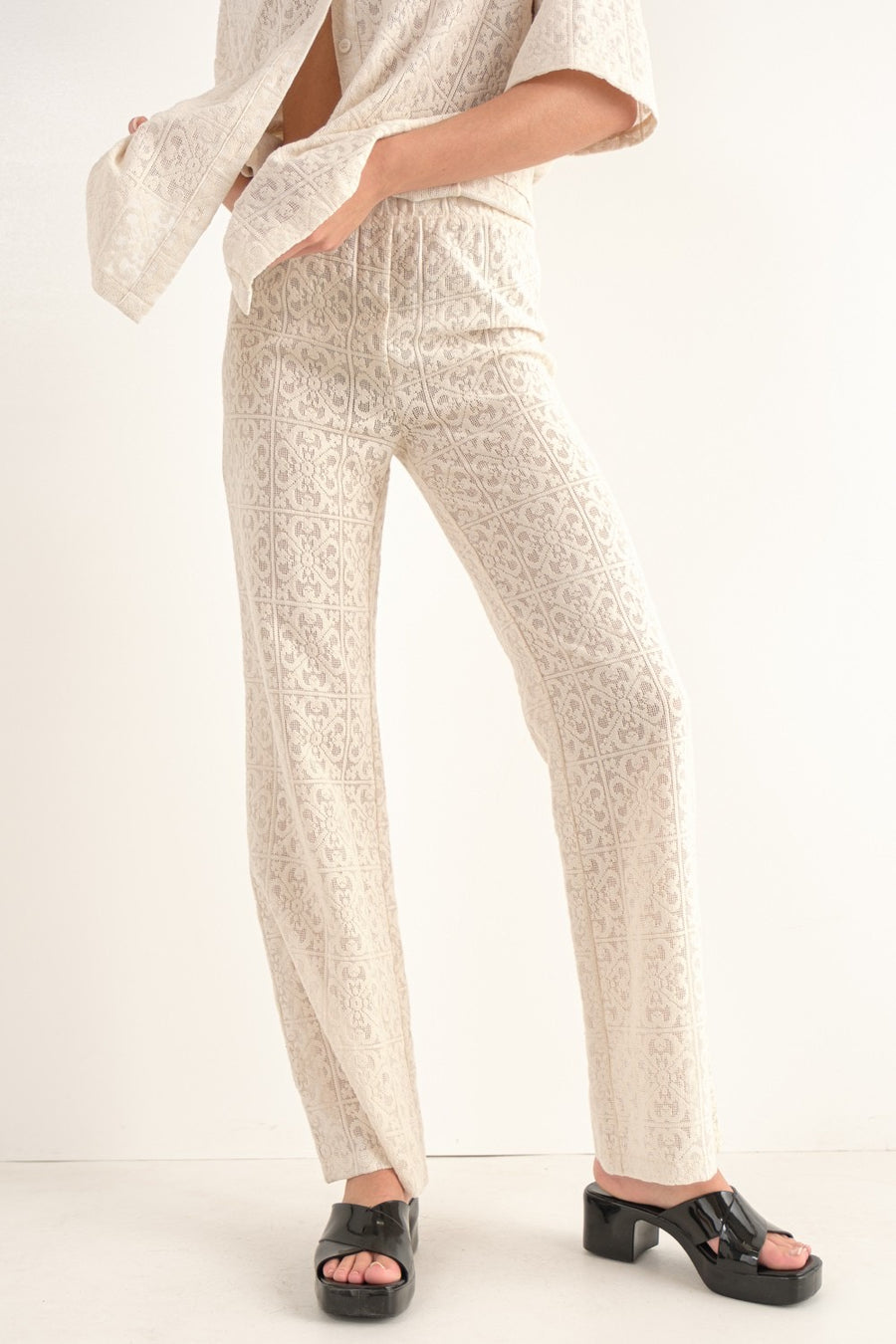 Crochet lace pants in the color cream.