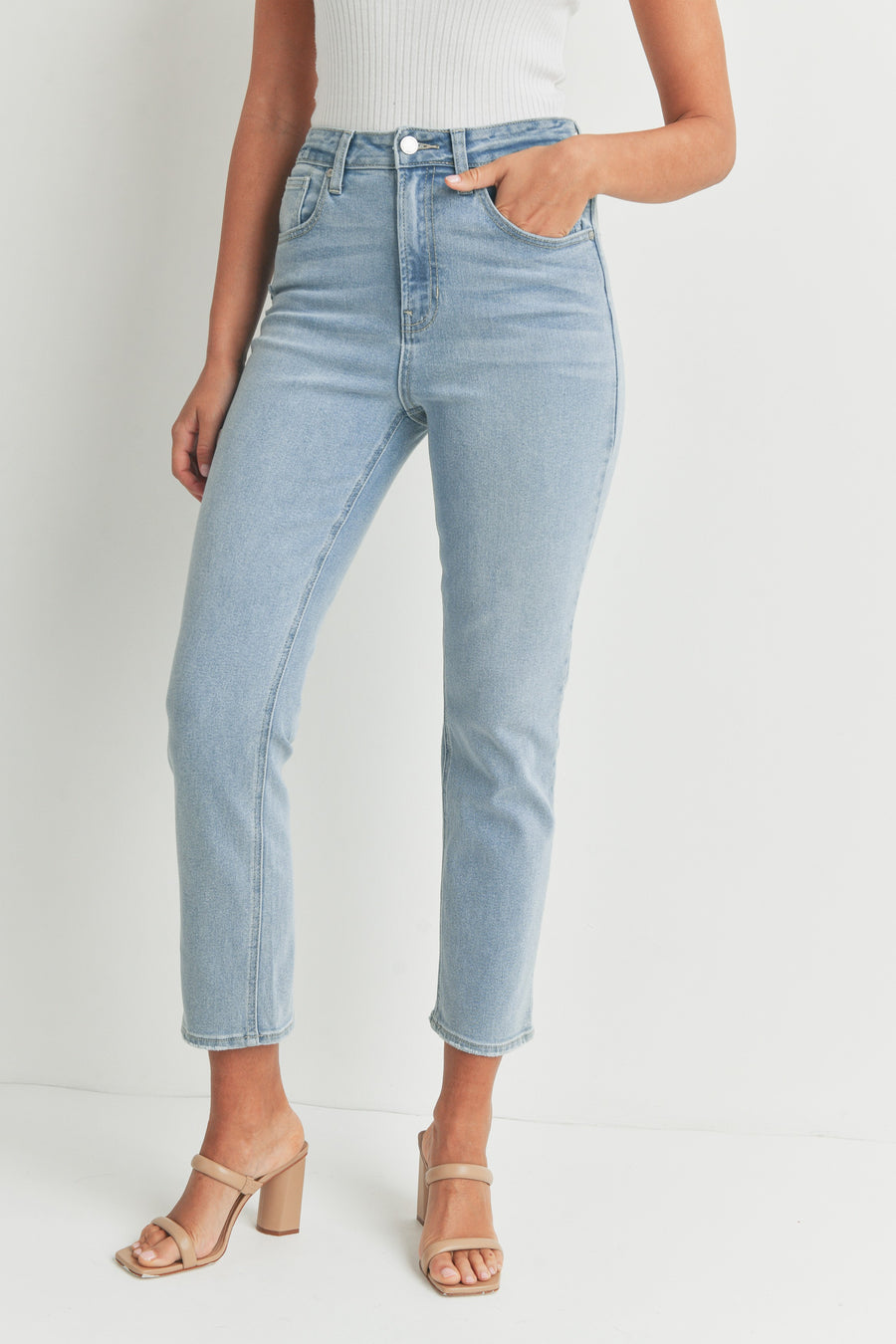 Light denim high rise and slim fit jeans.