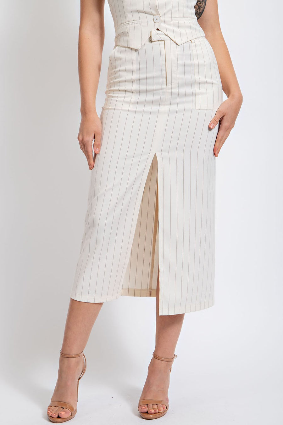 Ivory midi skirt with a front slit. 