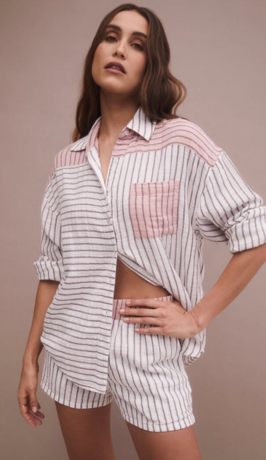 Long sleeve button down top with stripes in the color bone. 