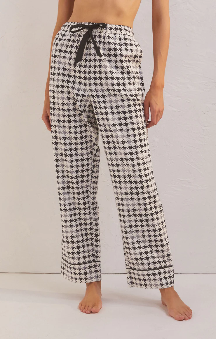 Drawstring waistband pajama bottoms with houndstooth pattern.