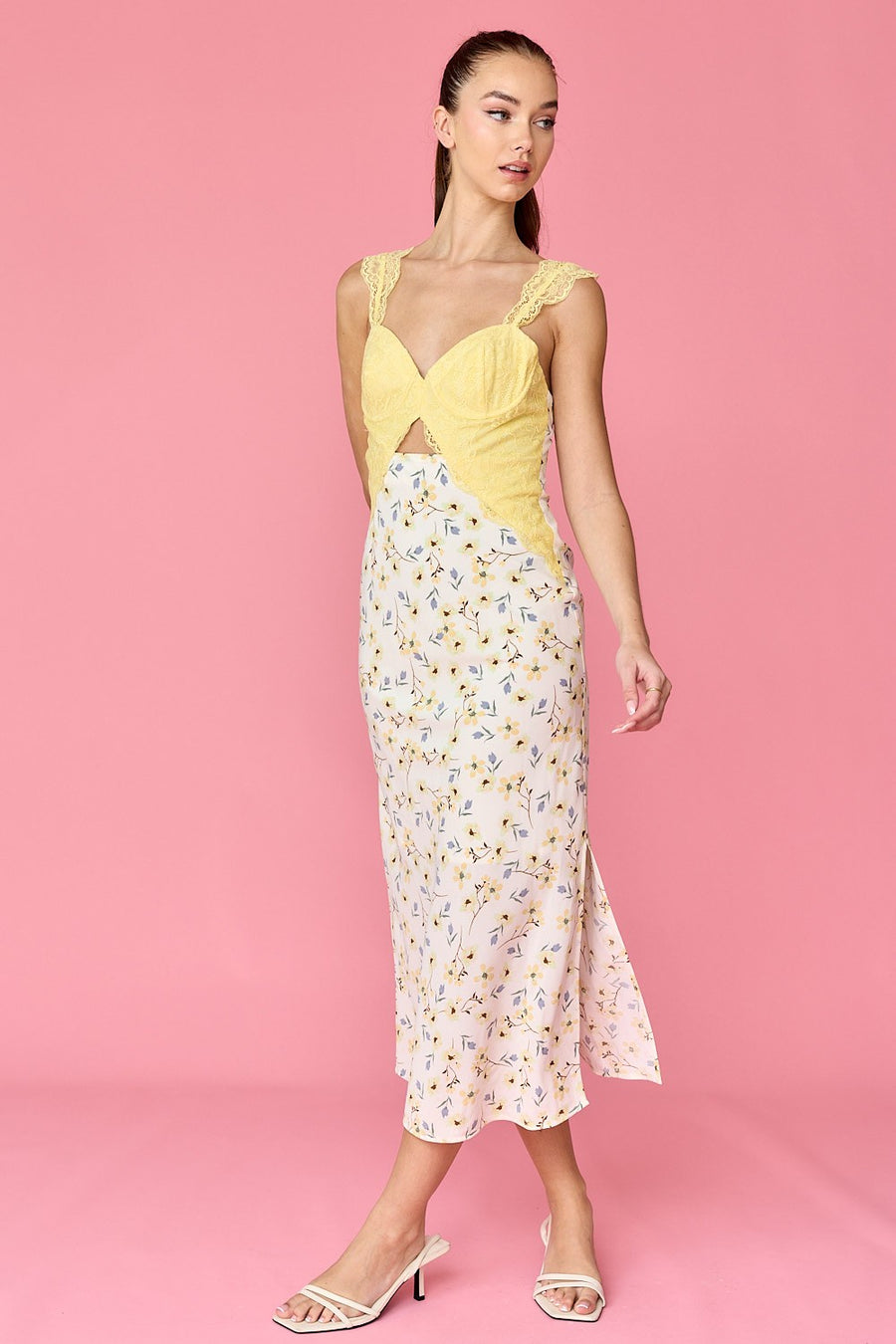 Featuring a floral pattern midi dress with yellow lace detailing and a cutout design.