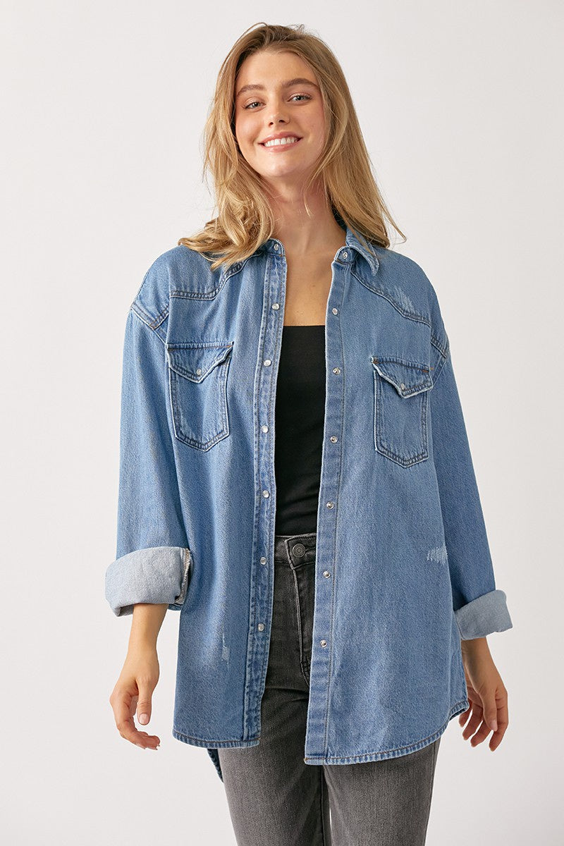 Featuring a relaxed fitting denim jacket with a button-down front closure.