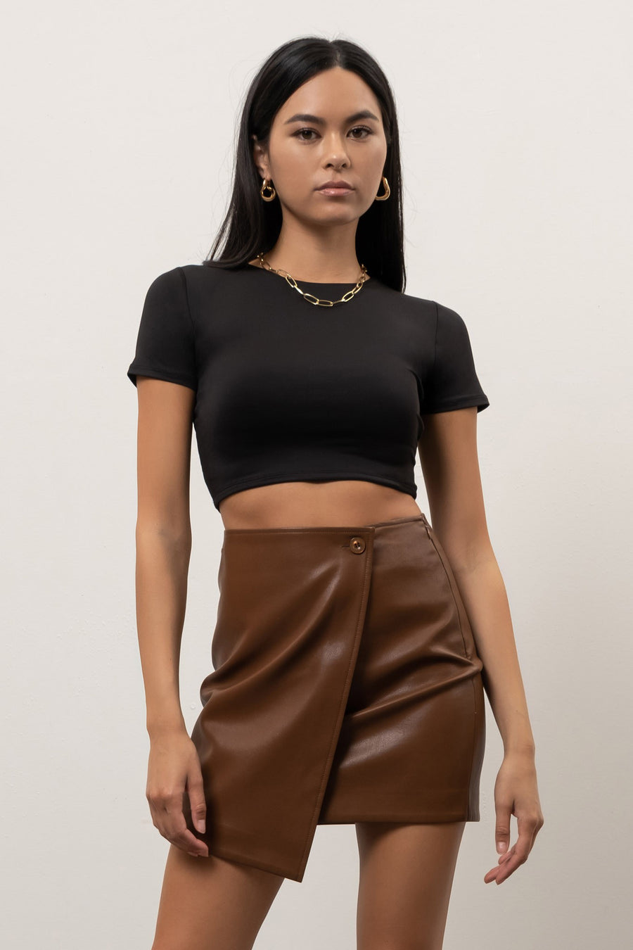 Featuring a short sleeve, round neck, cropped top