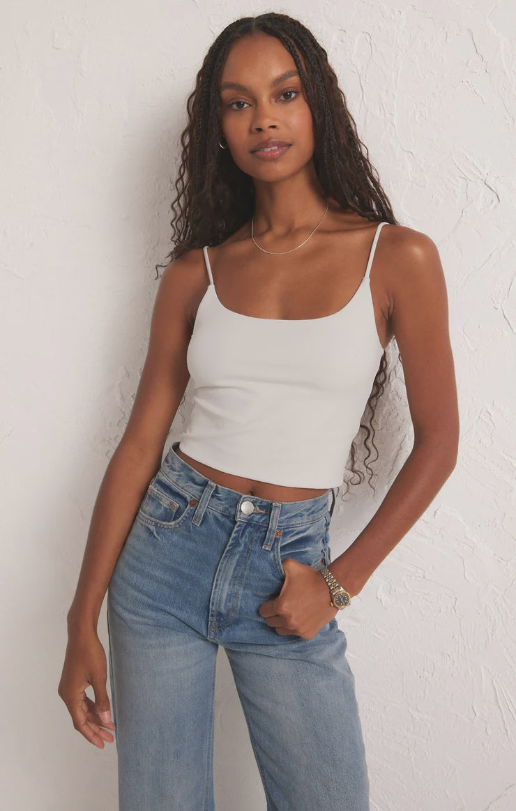 Featuring a fitted cropped cami in the color white