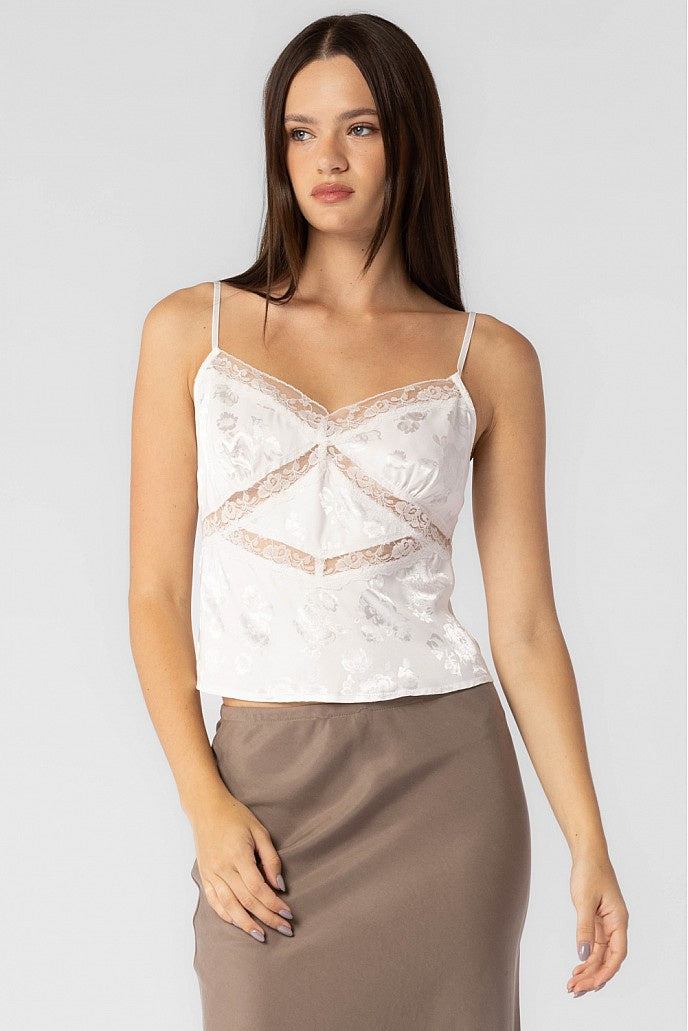 Spaghetti strap satin top with lace detail overlay.