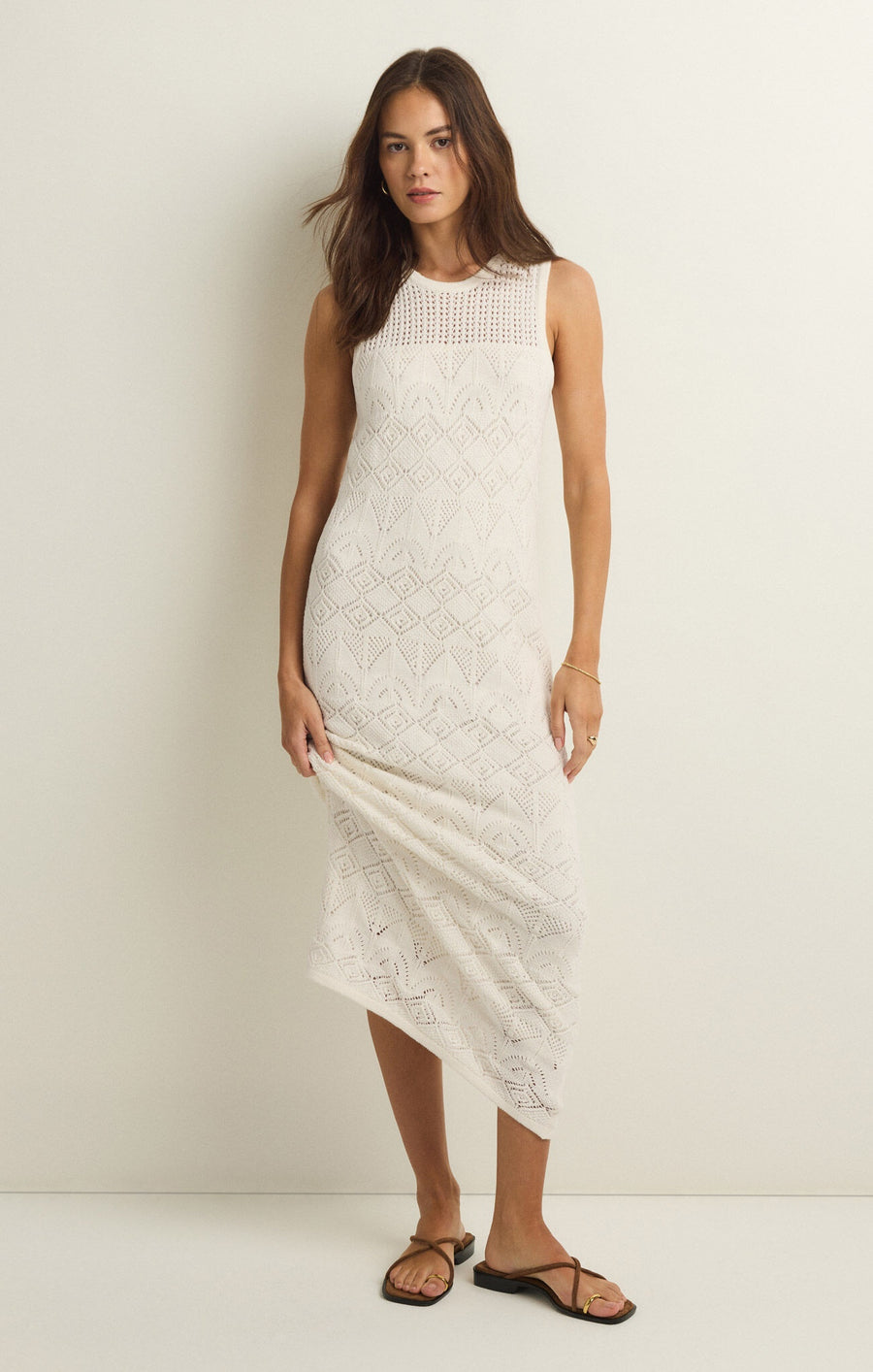 Featuring a sleeveless high neck mesh midi dress in the color white 