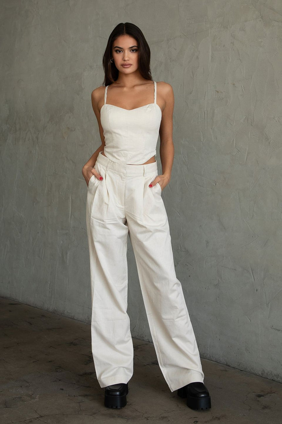 Featuring a straight leg linen pant in the color Natural 